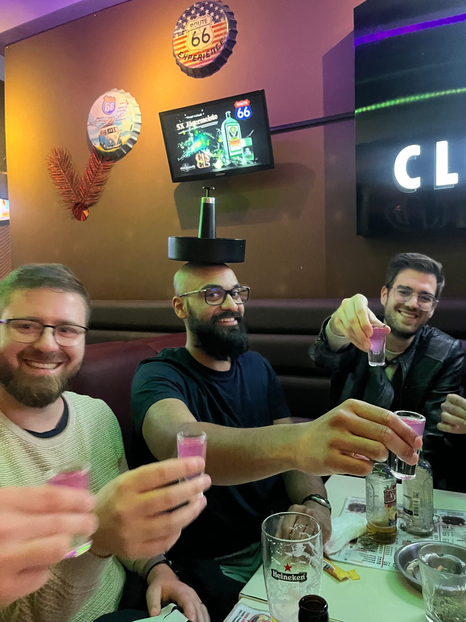 Friends enjoying drinks at an Amsterdam bar