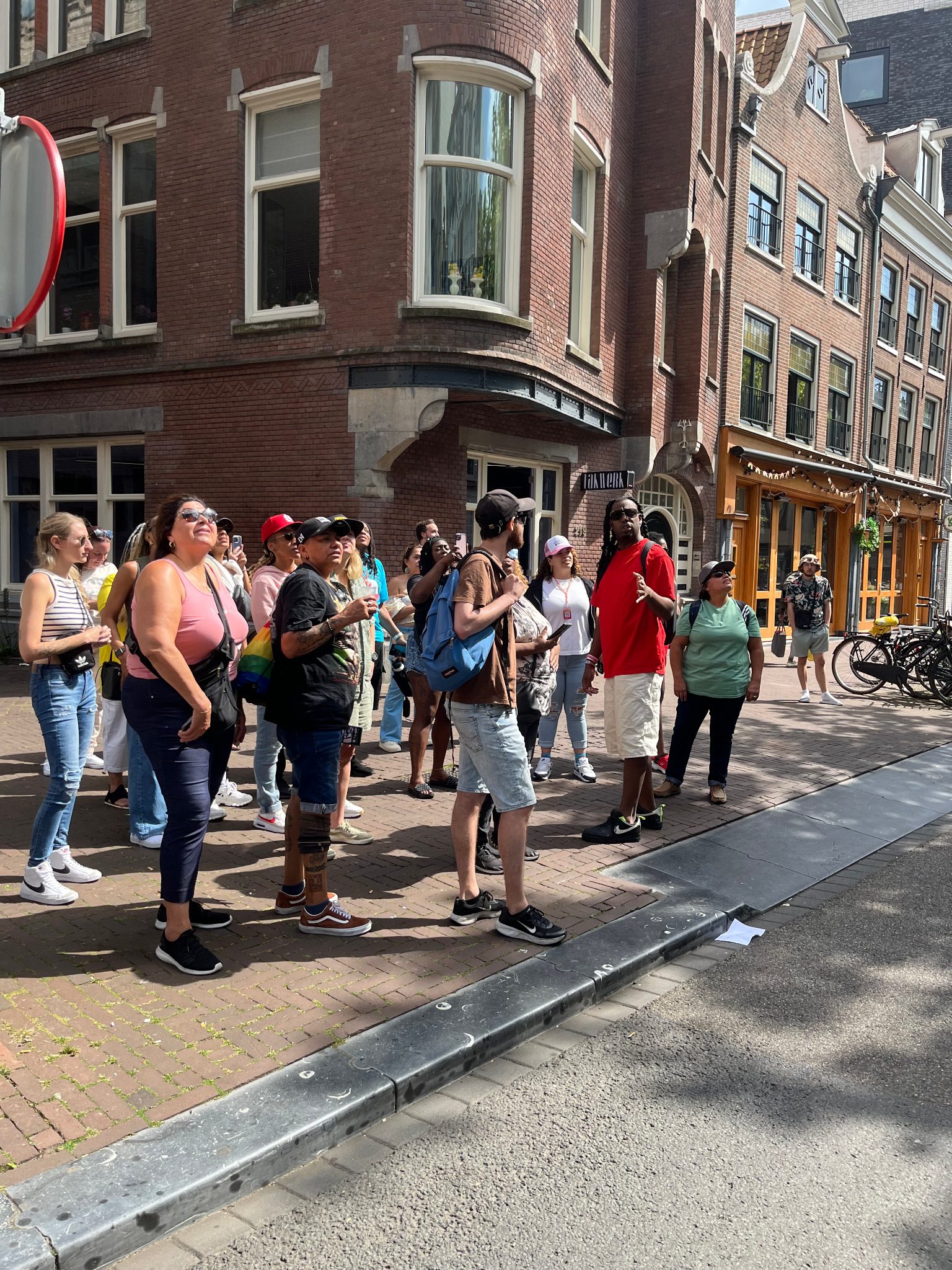 Private walking tour group on a historic Amsterdam street corner