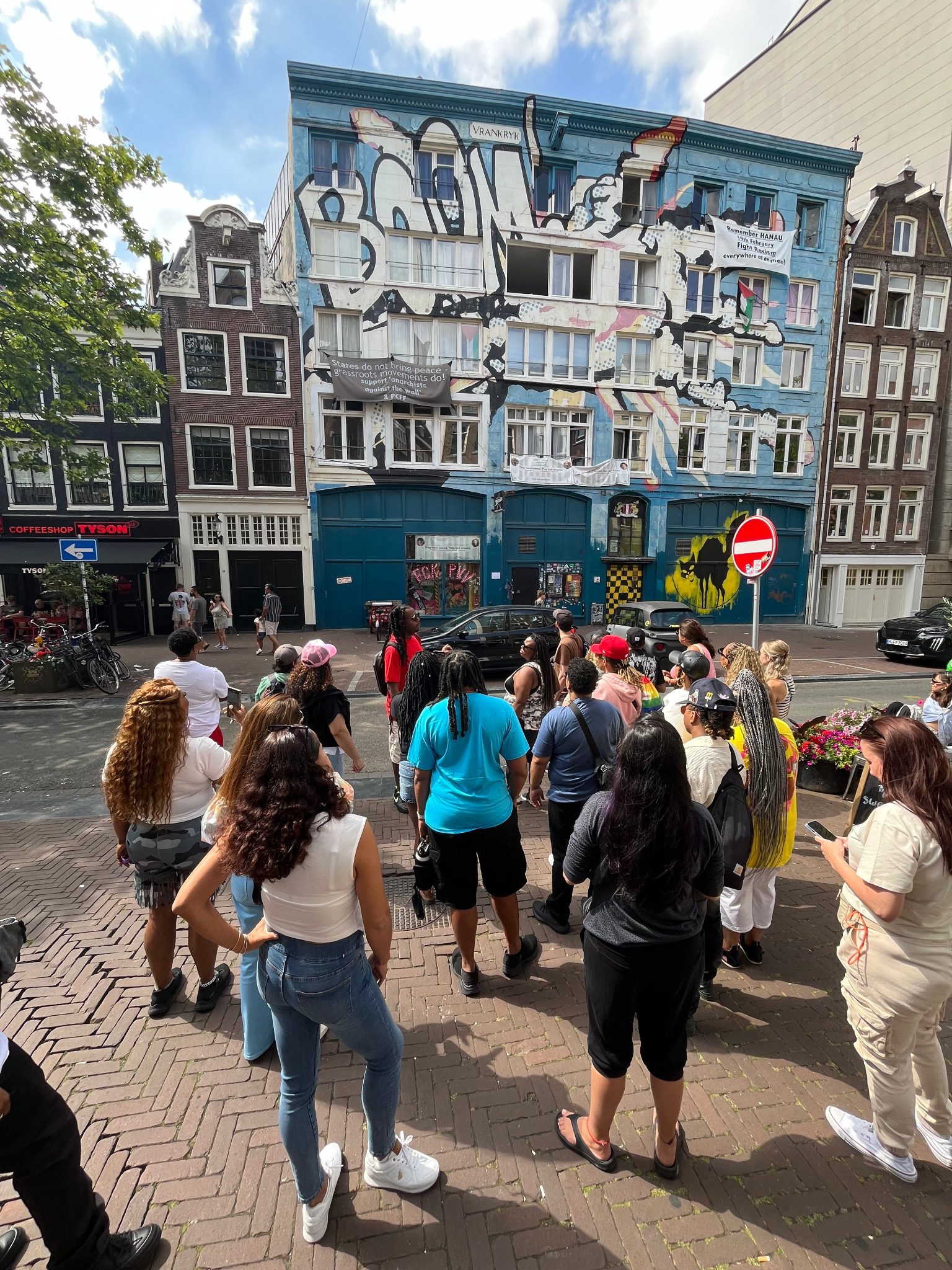 Tour group exploring Amsterdam streets and architecture