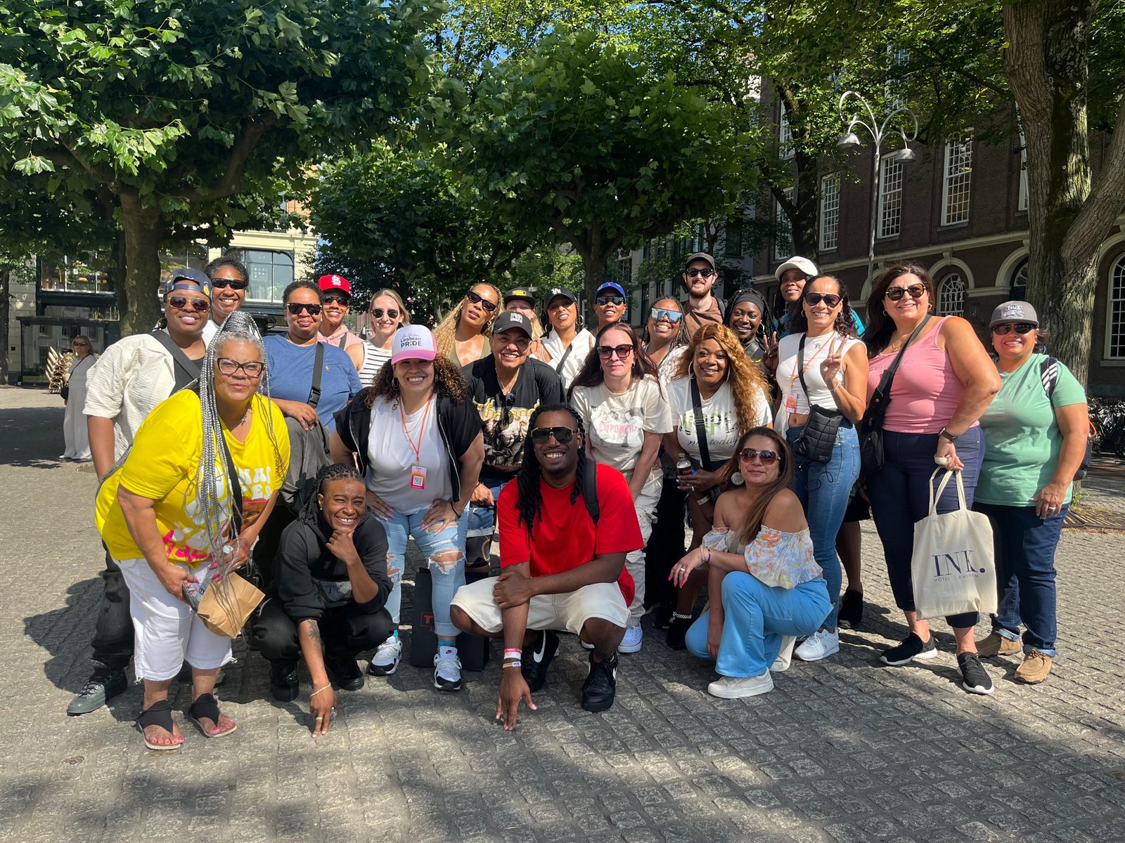 Large tour group photo in an Amsterdam square