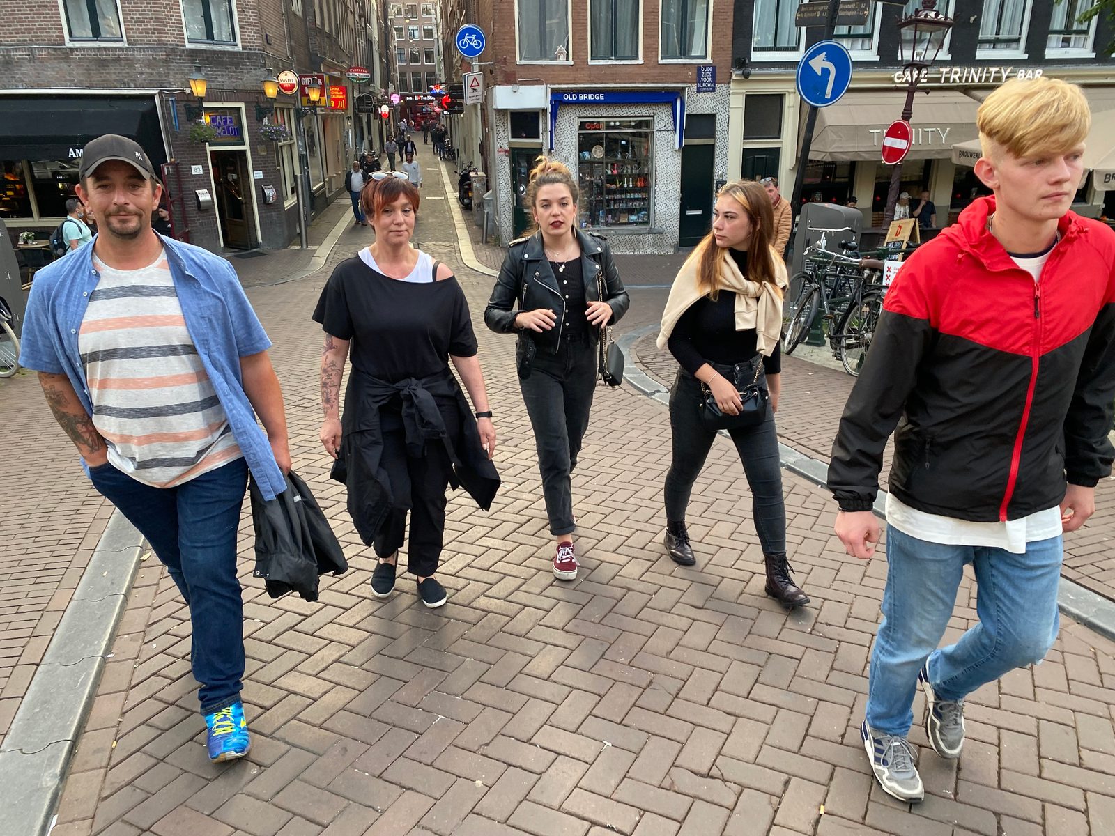 Family walking through Amsterdam city streets